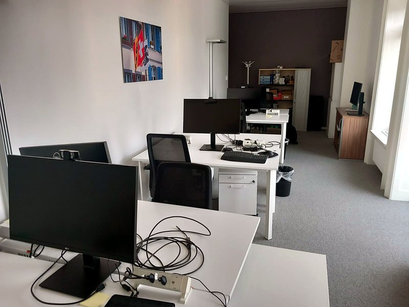 New office floor with desks, monitors and cabling set up for staff