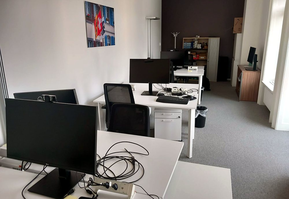 New office floor with desks, monitors and cabling set up for staff