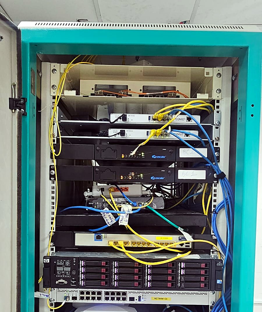 Equipment cabinet with servers, switches, fibre links and a wireless access point installed and cabled